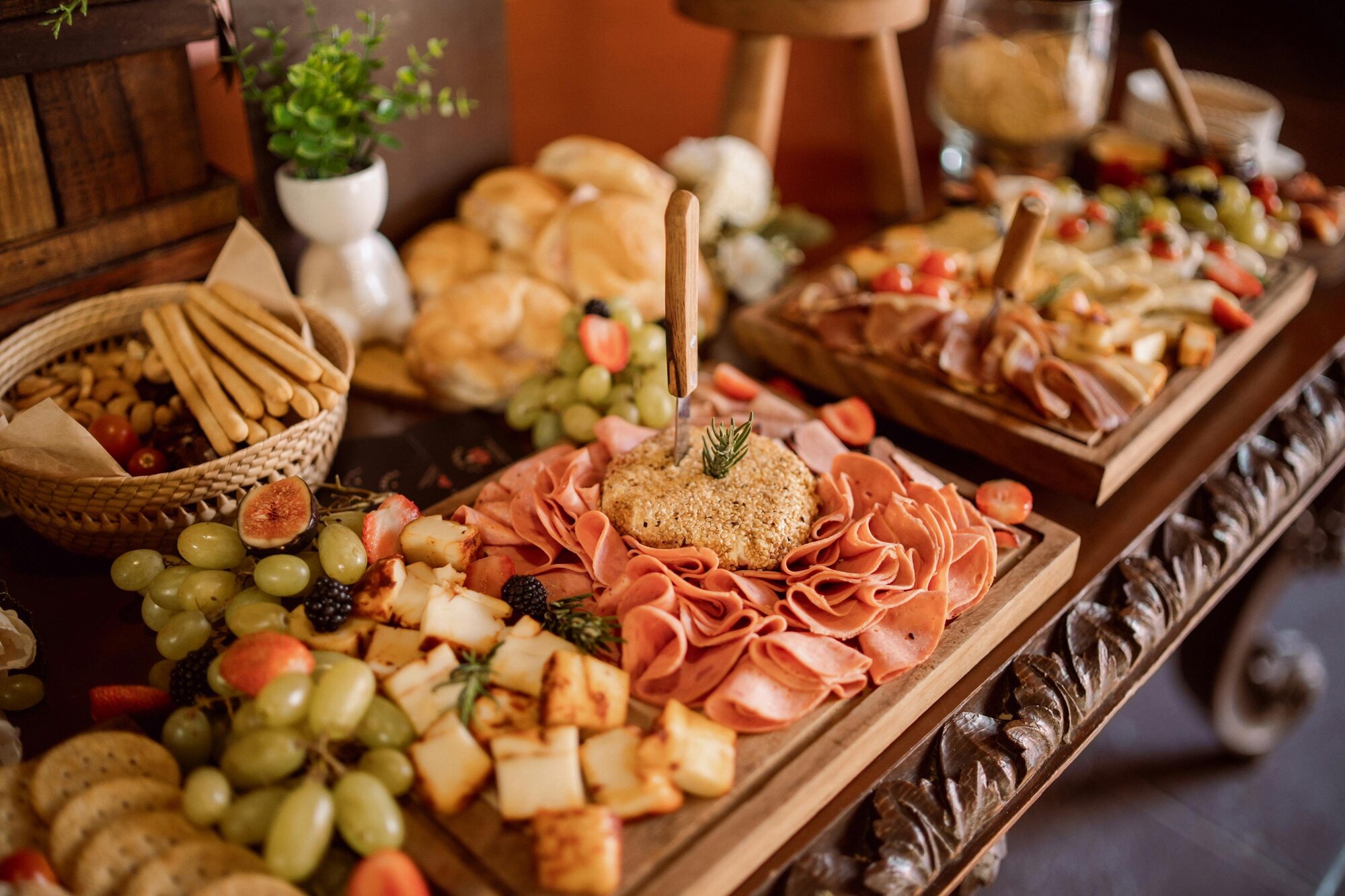 Artisan charcuterie board with premium cheeses, cured meats, and seasonal fruits